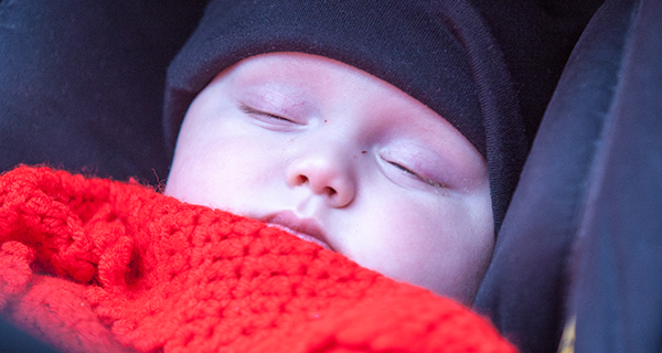 Baby asleep in a pram