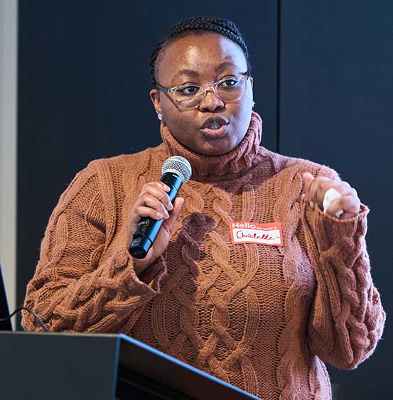 A staff member speaking at an event