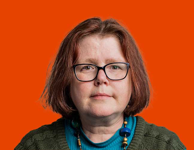 Co-production partner Jo who has a brown bob and is wearing glasses