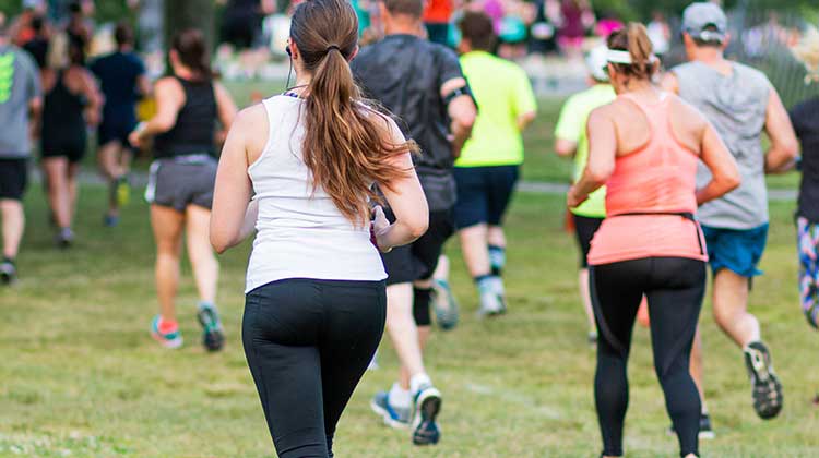 Runners competing in a park event