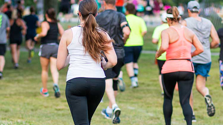 Runners competing in a park event