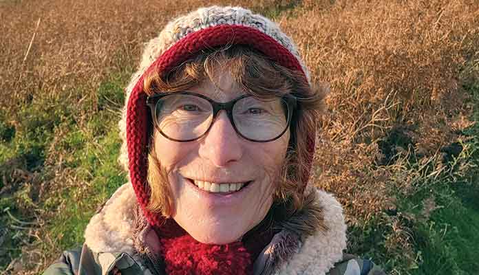 Smiling woman wearing wool hat