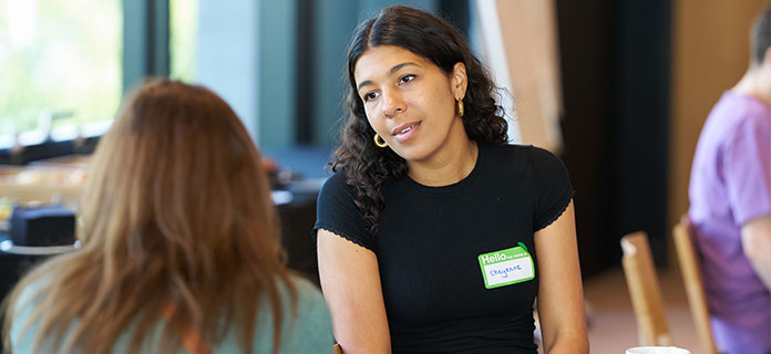 A Turn2us Co-Production Partner in conversation at a Turn2us event
